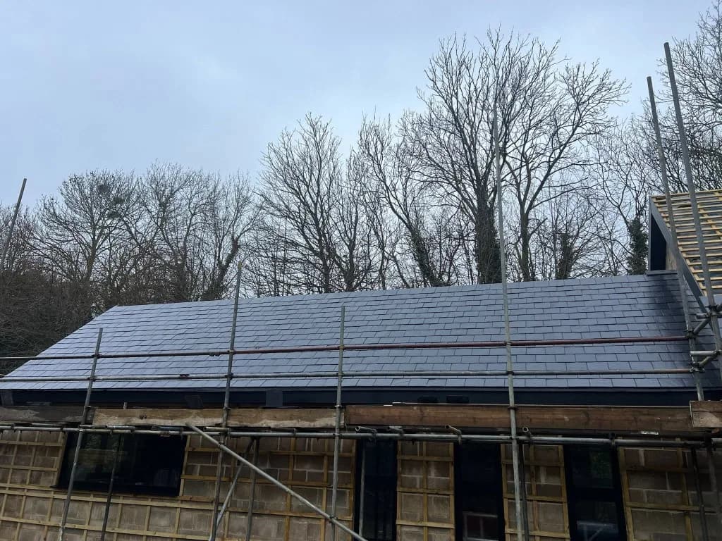 Roof before the loft conversion, freshly re-slated with scaffolding up and the dormer frame under construction