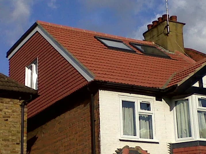 Hip-to-gable loft conversion with tiled dormer and rooflights