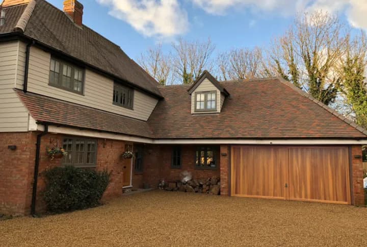 Substantial family home with brick, timber cladding and a clay tile roof, the kind of streetscape Article 4 directions are written to protect