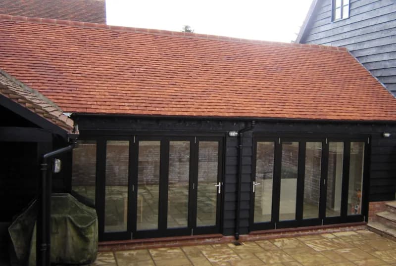 Timber-clad garden extension with bifold doors, the kind of permitted-development project a lawful development certificate protects